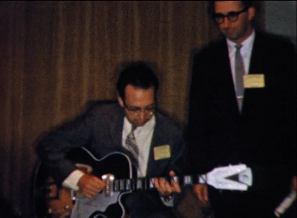 Barney Kessel at NAMM 1957 with a Kay Barney Kessel Jazz Special